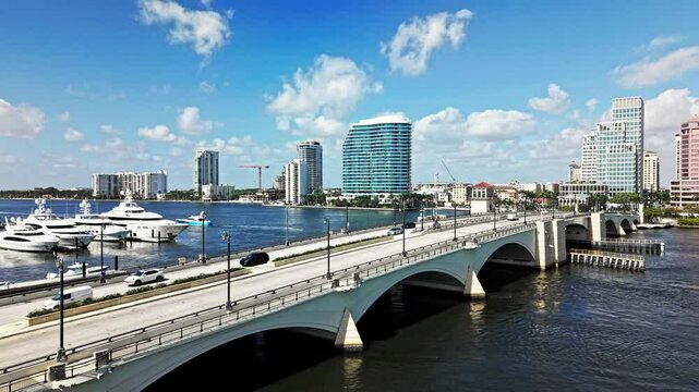 Pull out drone shot of Royal Park Bridge with One Flagler and Phillips Point building in West Palm Beach, Florida, USA
