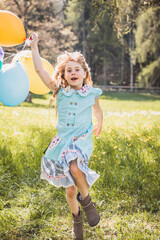 Kind/Mädchen mit Luftballons