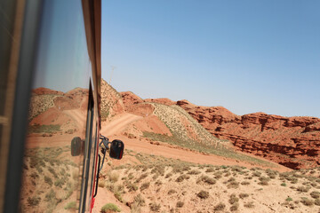 Beautiful landscape of Pingshan Hu Grand Canyon reflection in bus window, Zhangye City, Gansu Province in China
