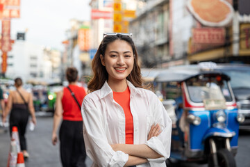 Asian woman enjoy eating street food at night market. Traveler Asian blogger women Happy tourists Beautiful female with Traditional food local road at thailand bangkok city.