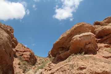 Fototapeta premium View of Pingshan Hu Grand Canyon is mainly composed of red gravel, sandstone, mudstone and is the only composite area of Danxia landform and colored hills in China