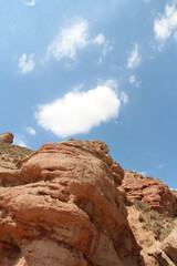 Fototapeta premium View of Pingshan Hu Grand Canyon is mainly composed of red gravel, sandstone, mudstone and is the only composite area of Danxia landform and colored hills in China