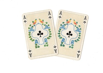 A pair of identical vintage playing cards isolated on a white background.
