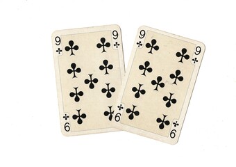 A pair of identical vintage playing cards isolated on a white background.