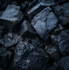 a load of heavy dark boulders crammed at the bottom of the frame, dark heavy colour, feeling of weight