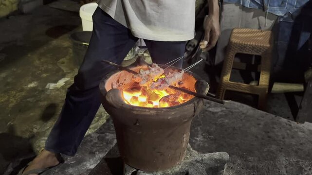 Traditional Javanese Satay Preparation over Charcoal Grill in Yogyakarta, Indonesia &ndash; Close-Up of Authentic Street Food Cooking with Glowing Embers