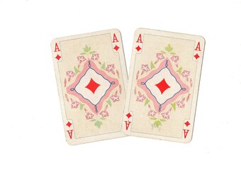 A pair of identical vintage playing cards isolated on a white background.