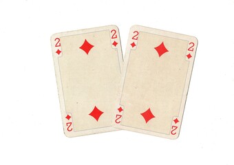 A pair of identical vintage playing cards isolated on a white background.