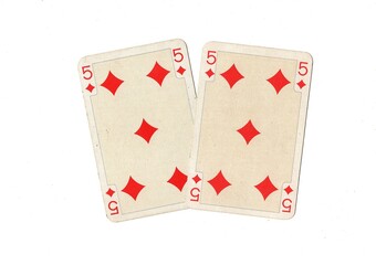 A pair of identical vintage playing cards isolated on a white background.