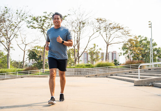 Senior old man runner exercise outdoor nature park. fitness man jogging wearing sportswear. Mature athlete man in sportswear Workout running at outdoor. Health and activity old man lifestyle