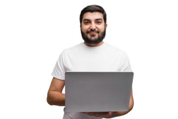 Young man with beard holding laptop in a bright, modern workspace, showcasing digital skills and creativity