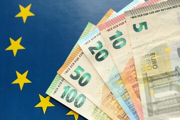 European union money currency Euro different paper notes on flag