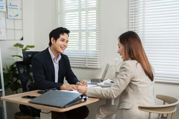Positive Financial Interaction. Colleagues sharing insights in a vibrant office.
