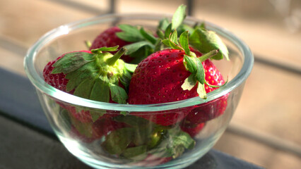 Fresh and Juicy beautiful organic strawberries on wooden background. Top view point.
