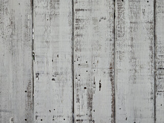 Weathered wooden planks with rustic white finish, showcasing texture and character. Ideal for backgrounds or design elements