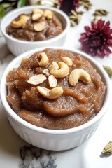 Traditional Aate Ka Halwa Garnished with Nuts, Presented Elegantly on Marble Surface