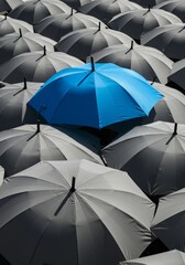 Photo Of Bright Blue Umbrella Above Grey Ones Demonstrating Uniqueness Concept