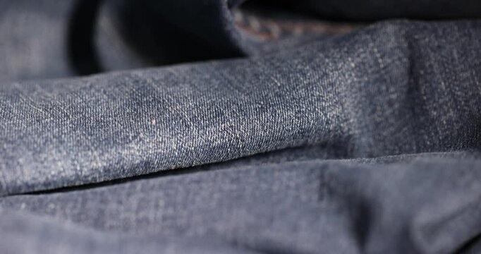 denim fabric for the production of clothing close up, the details of a piece of sturdy denim fabric for the production of clothing