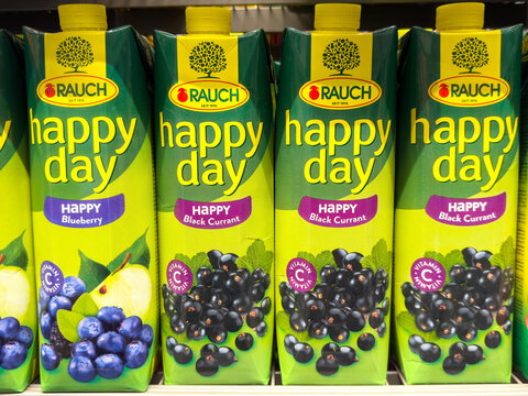 Assorted fruit juice cartons with blueberry and black currant flavors on shelf
