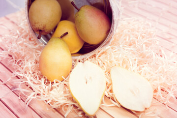 apples and pears rolled out of the basket