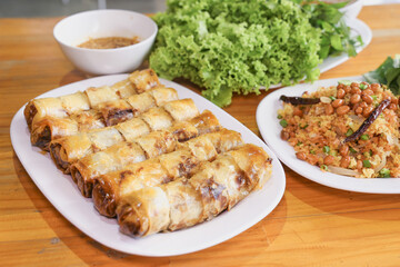Thai Deep-Fried Spring Rolls with Dipping Sauce and Fresh Vegetables