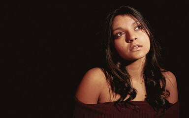 Brown Eyed Contemplation. A candid and thoughtful moment from a beautiful young mixed race...