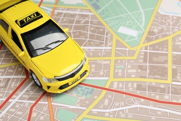 Road trip concept. Car model on city map, closeup