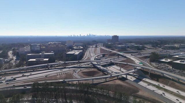 Aerial shot looking at Downtown Atlanta pulling back through The King and Queen Towers in Dunwoody.