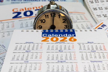 2026 calendar with clock. Yearly time and schedule concept.