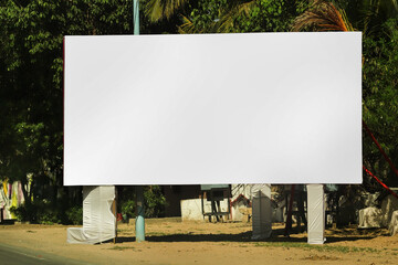 billboard on city road, outdoor advertising, mockup billing board in front of green tree and Blank...