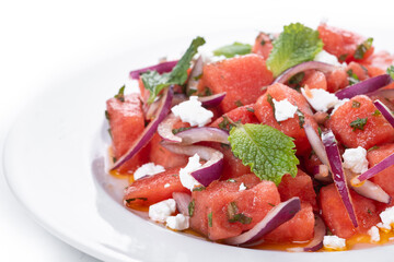 Fresh Watermelon Feta Salad with Mint and Red Onion isolated on white background