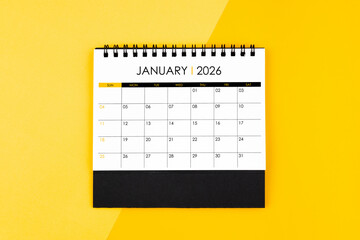 January desk calendar for 2026 year on yellow background for schedule to make appointment.
