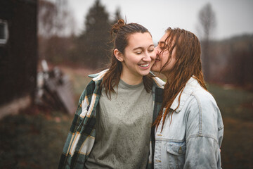 Fototapeta premium Lesbian Couple Together Outdoors in a rainy day