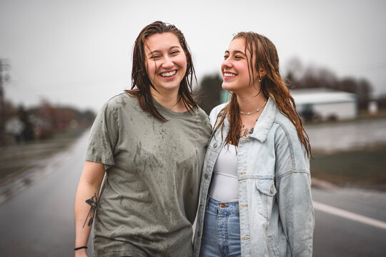 Lesbian Couple Together Outdoors in a rainy day
