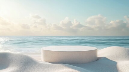Elegant cylindrical podium rests on white sand near serene blue ocean backdrop during daytime