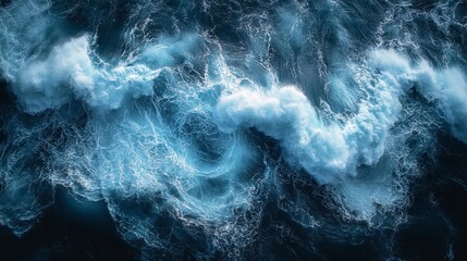 Obraz premium Aerial view of turbulent ocean waves, showing churning foam and dark blue water