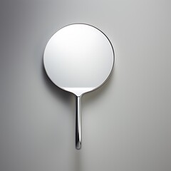 Sleek Silver Hand Mirror Reflecting Light with Minimalist Design, Perfect for Vanity, Beauty, and Personal Care Aesthetics.