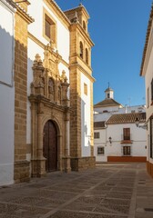 Fototapeta premium Photo of a Historic Church and Street Scene with Blue Sky and Sunlight in Spain