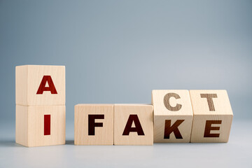 Tha alphabet wooden cubes arranged as a concept of AI information, fact and fake