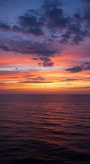 Photo Of A Vibrant Sunset Over The Ocean Displaying Dramatic Clouds And Color