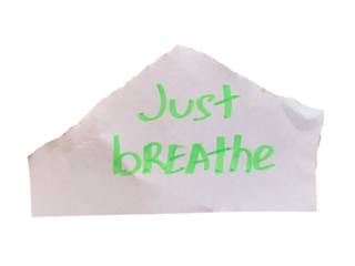 Torn white paper with handwritten green Just Breathe motivational text on transparent background