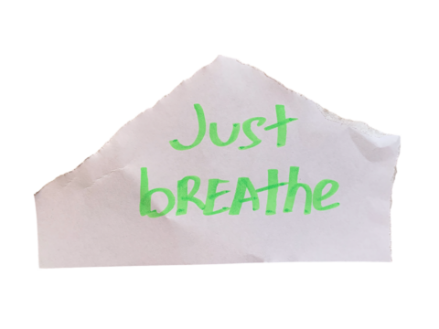 Torn white paper with handwritten green Just Breathe motivational text on transparent background - Powered by Adobe