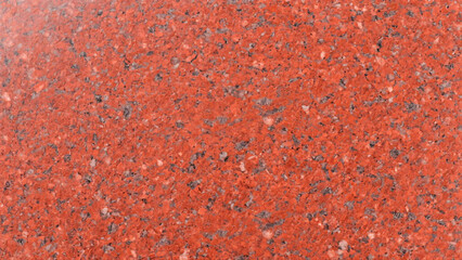 Close-up of a red granite texture, perfect for construction and design projects.
