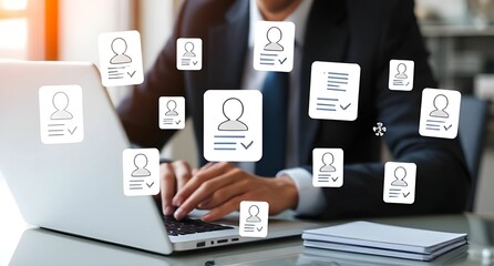  A professional individual is working on a laptop with floating icons of user profiles and CVs, symbolizing recruitment, online networking, and digital professional identities.