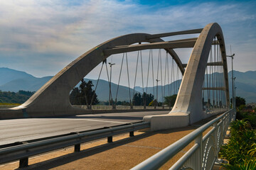 Ashton transverse tied-arch bridge crosses the Cogmanskloof River. Completed in 2020 after seven years of planning and construction this eye catching 110 meter bridge weighs around 8000 tons.