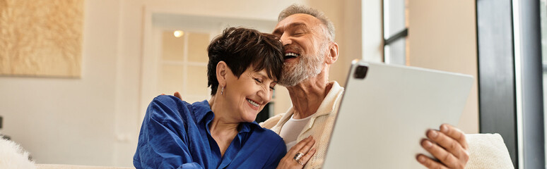 Joyful moments shared between a middle aged couple at home in a cozy setting