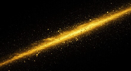Golden streak with droplets against black background creates a dynamic effect