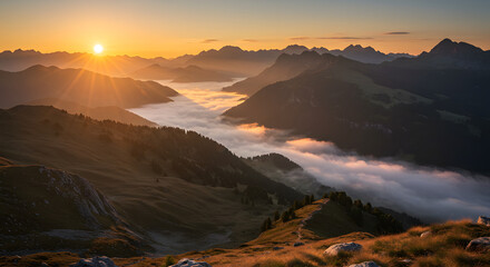 Naklejka premium Sunrise over the Mountains: The majestic sun emerges, casting a warm glow over the peaks, valleys, and a sea of clouds. A visual symphony of light and shadow.