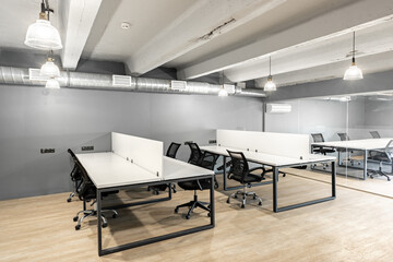 Modern office workspace with sleek furniture and minimalistic design in urban setting