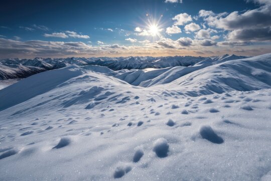 Mountain range with snow-covered peaks and a bright sunny day